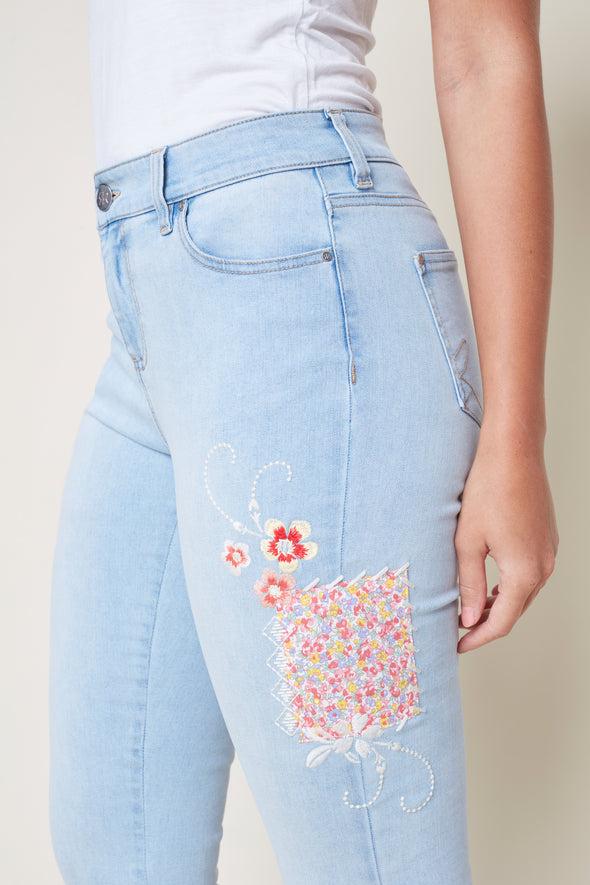 Jeans bleu fleur de côté gauche