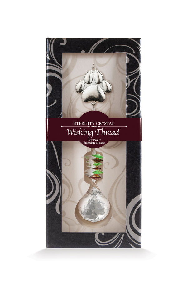 Fil à vœux Patte Eternity Crystal présenté dans sa boîte illustrée avec son cristal facetté.