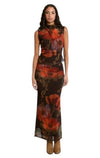 Jupe longue fluide à motif floral Dex, coloris brun à fleurs orange et rouges, vêtement porté en tenue