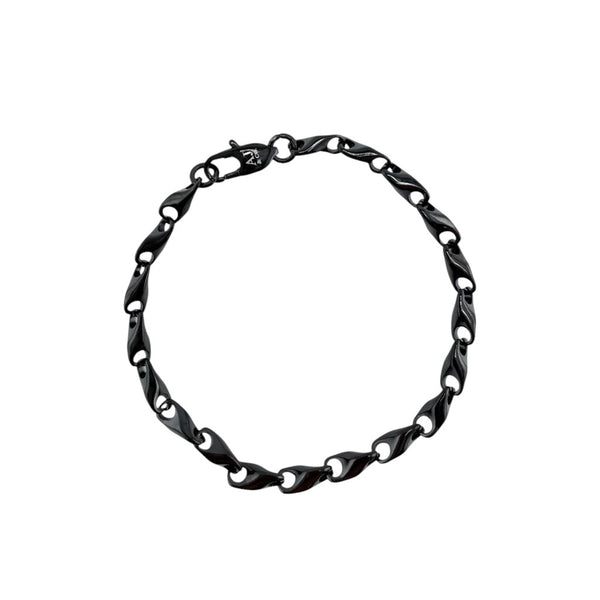 La Maison du Bleuet black PVD stainless steel link bracelet with a fluid, modern design and secure clasp.